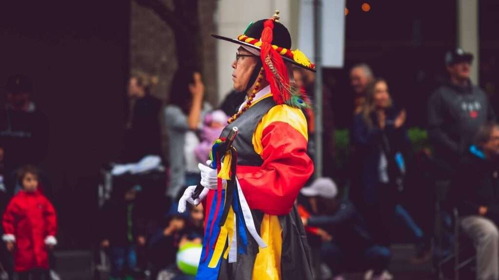person wearing red yellow and green dress