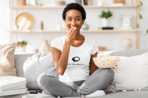 t-shirt-mockup-of-a-woman-eating-popcorn-at-home-45968-r-el2