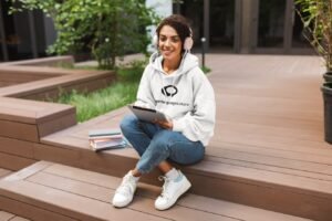 mockup-of-a-woman-with-an-oversize-hoodie-listening-to-music-while-studying-34151-r-el2