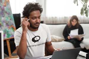 t-shirt-mockup-of-a-customer-service-worker-at-his-desk-m11955-r-el2