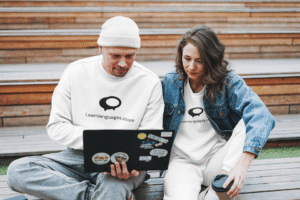 sweatshirt-mockup-featuring-a-couple-looking-at-their-laptop-45332-r-el2